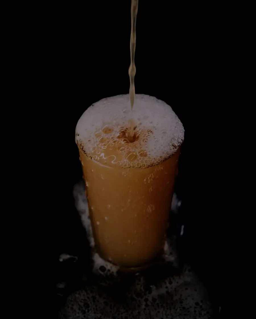 A glass of lager — Gorkha Strong beer, delivered across Kathmandu Valley by Raksi Hour.