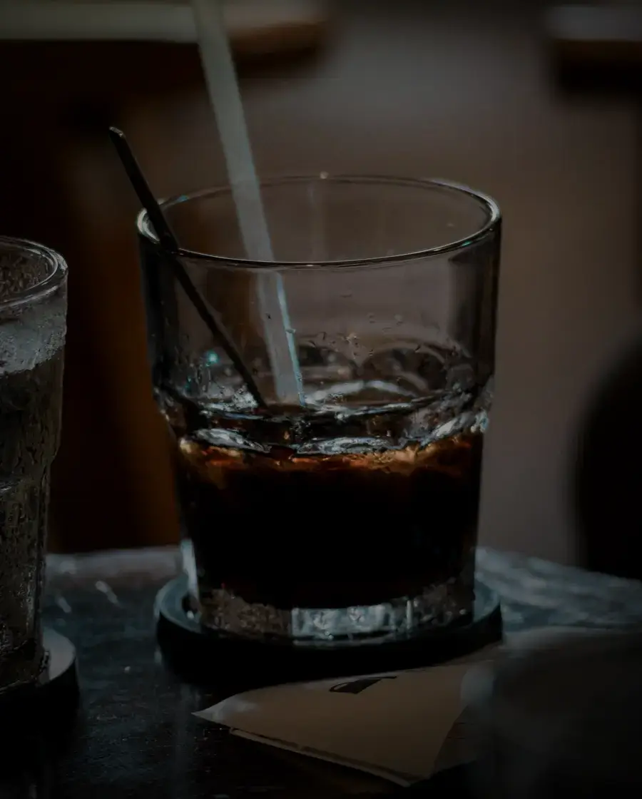 A cold drink with ice and straws — mixers, sodas and water, delivered across Kathmandu Valley by Raksi Hour.