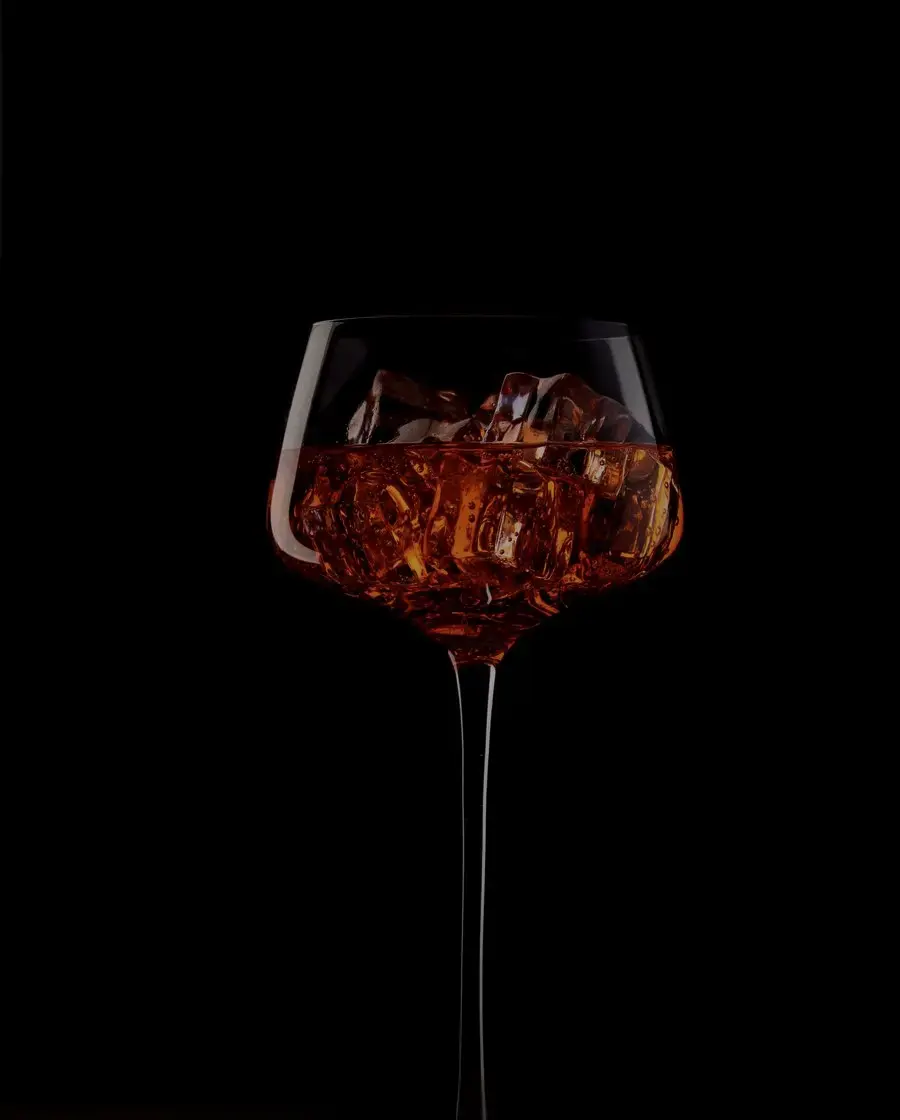 An amber spirit in a stemmed glass — Golden Oak whisky, delivered across Kathmandu Valley by Raksi Hour.