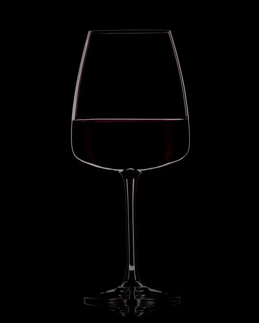 A filled wine glass on a dark surface — Manang Valley Premium Sweet White Wine, delivered across Kathmandu Valley by Raksi Hour.